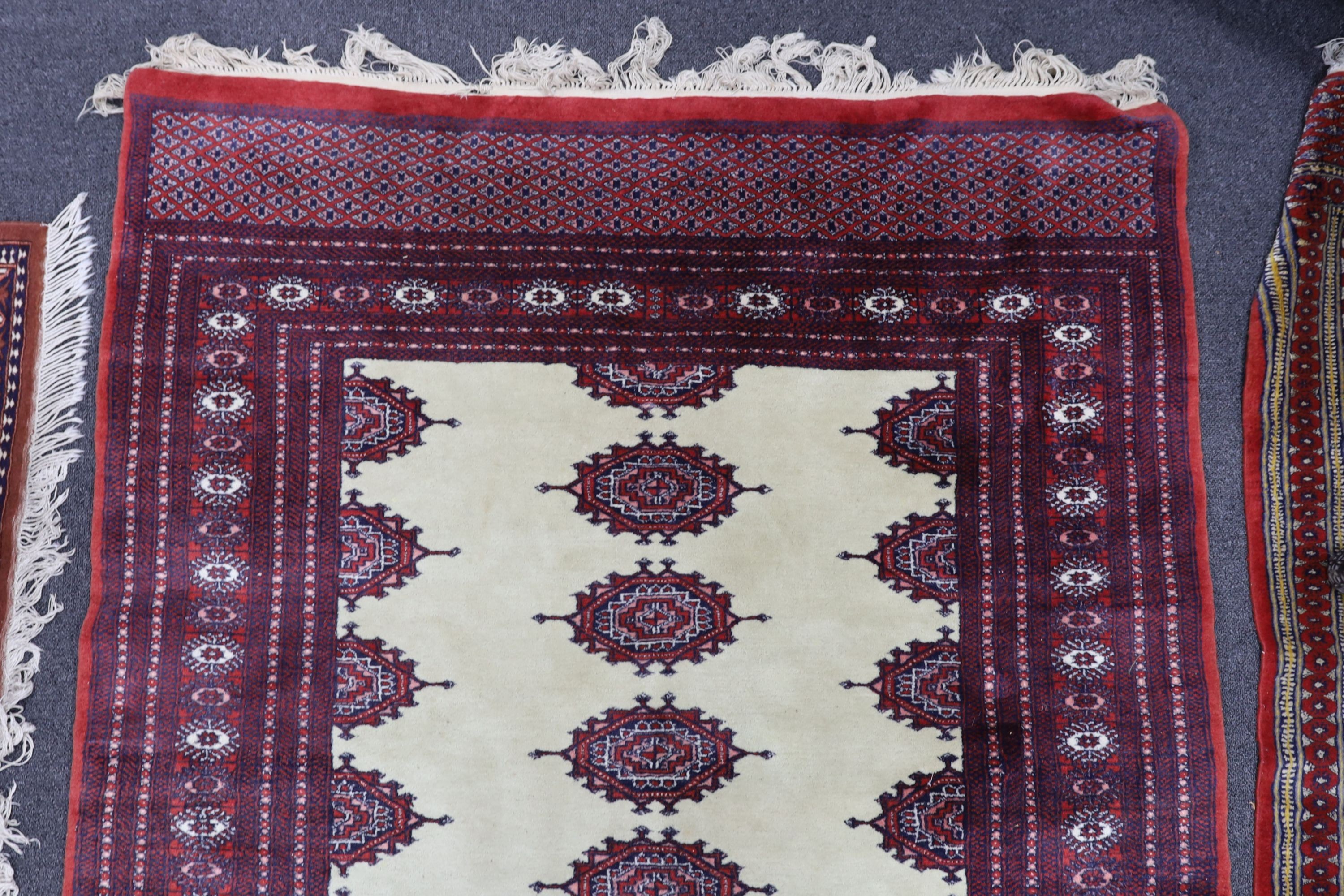 A Bokhara ivory ground rug, 190 x 125cm